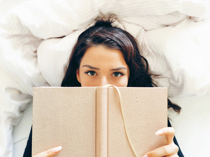 Girl Reading on Bed