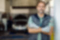 portrait-happy-car-service-owner-with-arms-crossed-his-workshop (1).jpg