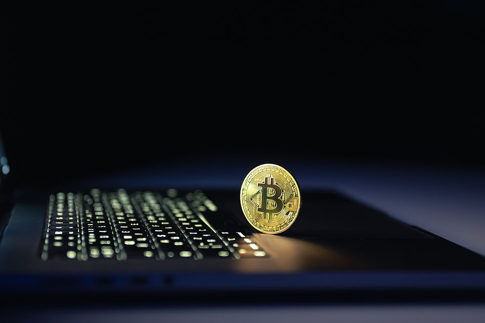 bitcoin-coin-near-laptop-black-background-finance-crypto-money-concept.jpg