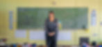 Teachers Plus graduate, Simone Abrahamse in  south african school Classroom in front of a chalkboard teaching Mathematics