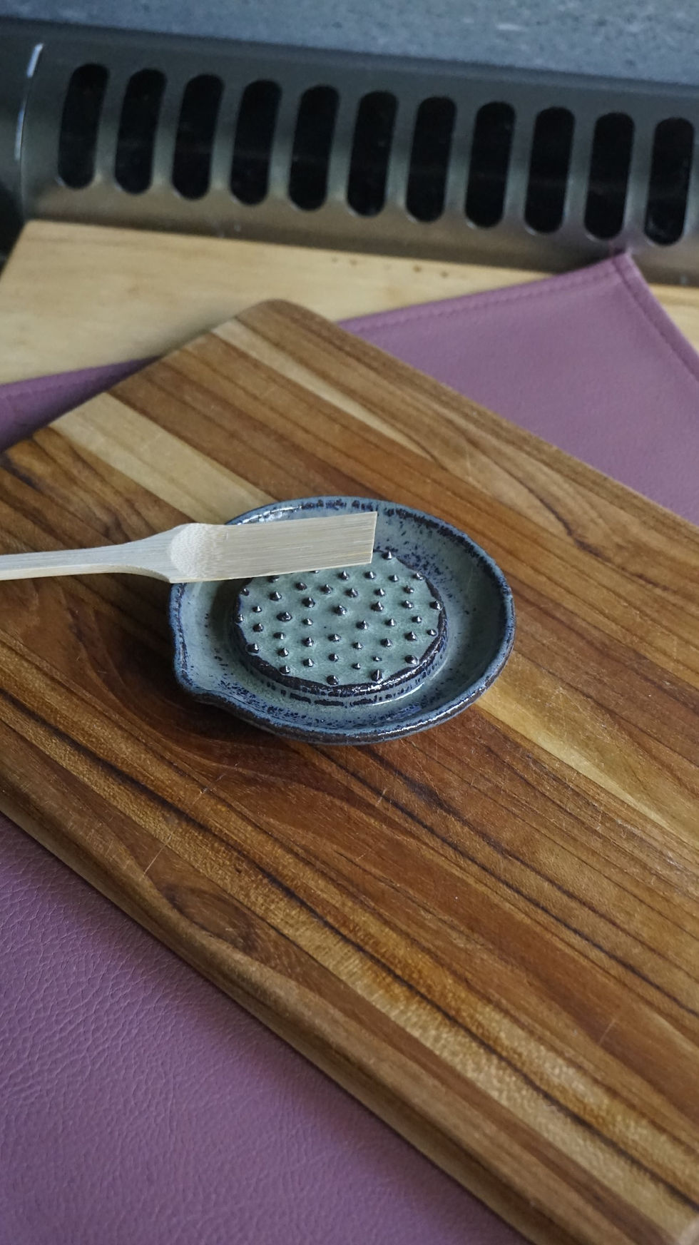 Thumbnail: Green pottery ginger grater with a grater brush top view