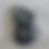 Thumbnail: 2 black clay globe mugs with a sparkly black glaze stacked on top of each other  side view