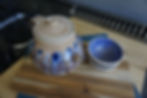 Purple and cream teapot with 2 small cups top view