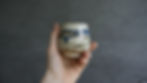 Ceramic Japanese-inspired teacup with ash glaze side view
