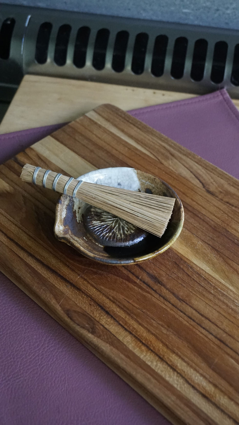 Thumbnail: White, green and brown pottery ginger grater with a grater brush top view