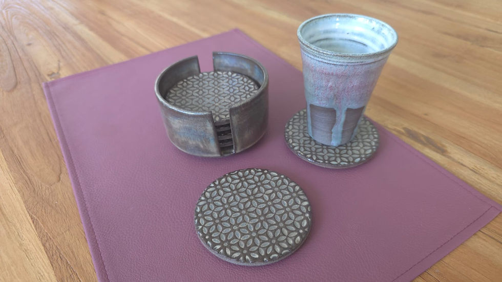 Thumbnail: Brown ceramic coasters with holder and a cup