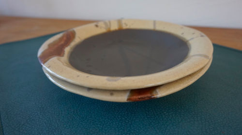 Thumbnail: two ceramic pasta plates in shades of brown side view