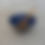 Thumbnail: ceramic bowl with a brown, pink and blue glaze with indigo interior and a wooden spoon