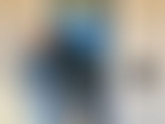 Woman standing with dog in front of new home with address 911