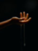 A snapshot of a hand with Zilla Snail Mucin dripping down