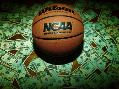 college athlete reviewing NIL contract with legal advisor before signing endorsement deal