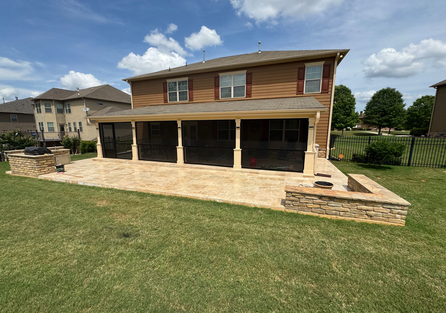 Screened patio addition with stonework and fire pit