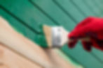 Hand painting wood, representing painting services