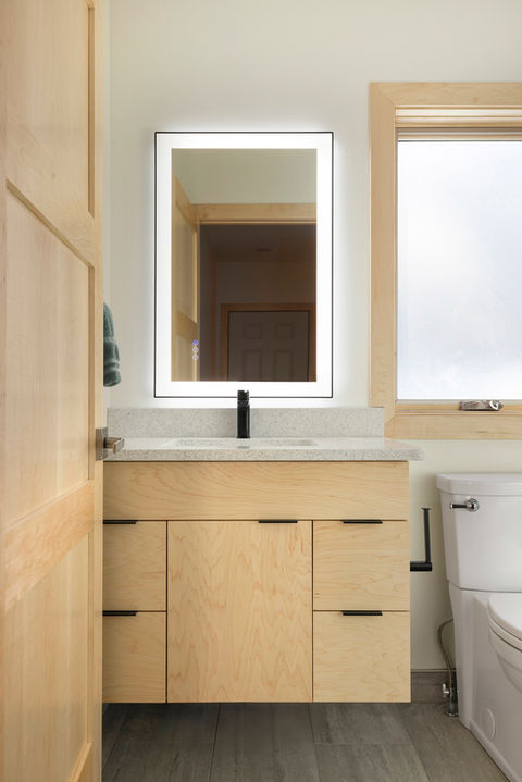 Completed bathroom addition by 1st Call Construction & Exteriors in Minnesota, featuring custom vanity, modern fixtures, and updated finishes.