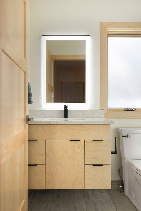 Completed bathroom addition by 1st Call Construction & Exteriors in Minnesota, featuring custom vanity, modern fixtures, and updated finishes.