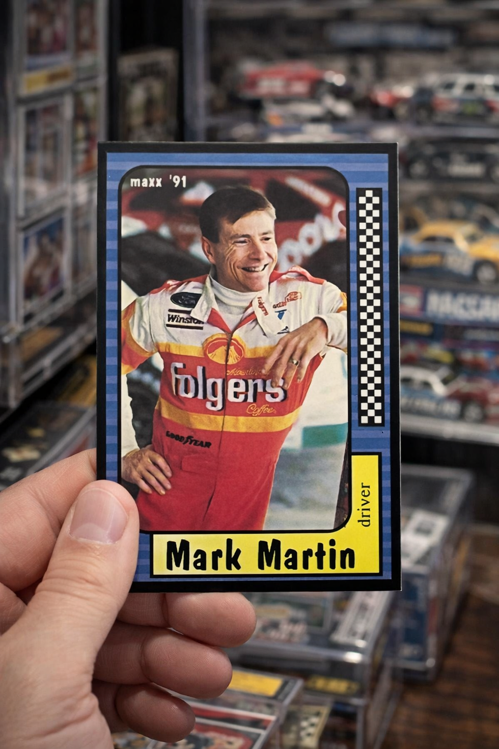A collector holds a collectible Mark Martin card 