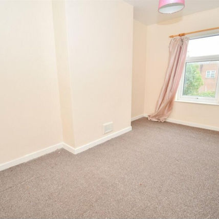 Empty room with beige walls