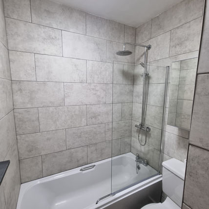 Modern bathroom with white bathtub