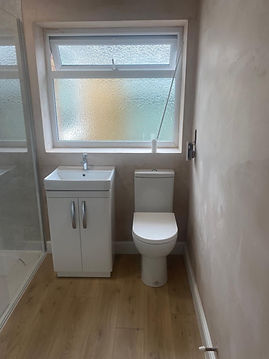 Small bathroom with a white sink and toilet