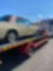 Classic car on tow truck