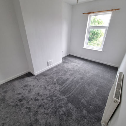 Renovated room with white walls