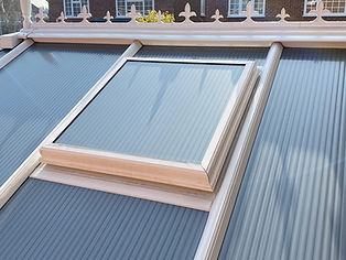 Close-up of a conservatory roof with a rectangular double-glazed window
