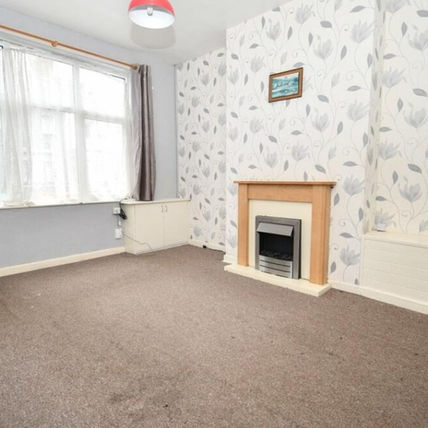 Unfurnished living room with gray walls