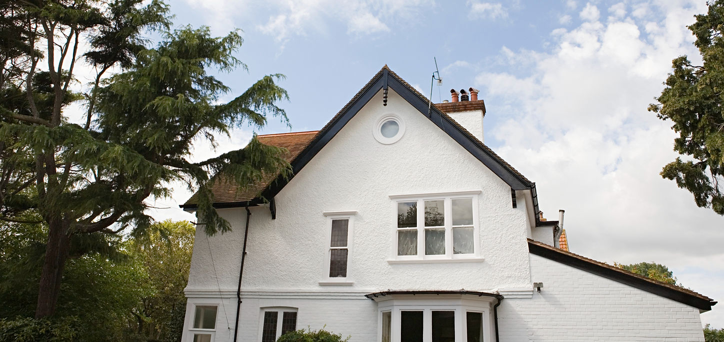 White two-story house with a gabled roof