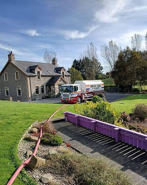 Truck outside house delivering fuel
