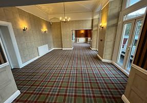 Elegant room with patterned plaid carpet