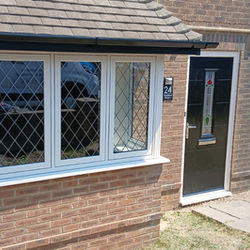brown uPVC bay window before replacement in Weymouth