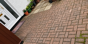 Garden patio area featuring neat mono block paving blocks and decorative gravel