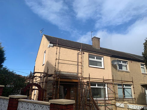 Semi-detached house with scaffolding on the front