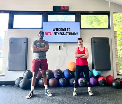 Meala and Khalil posing at the gym