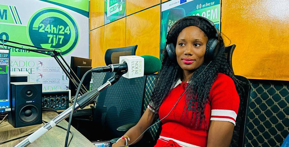 Woman being interviewed in a radio station