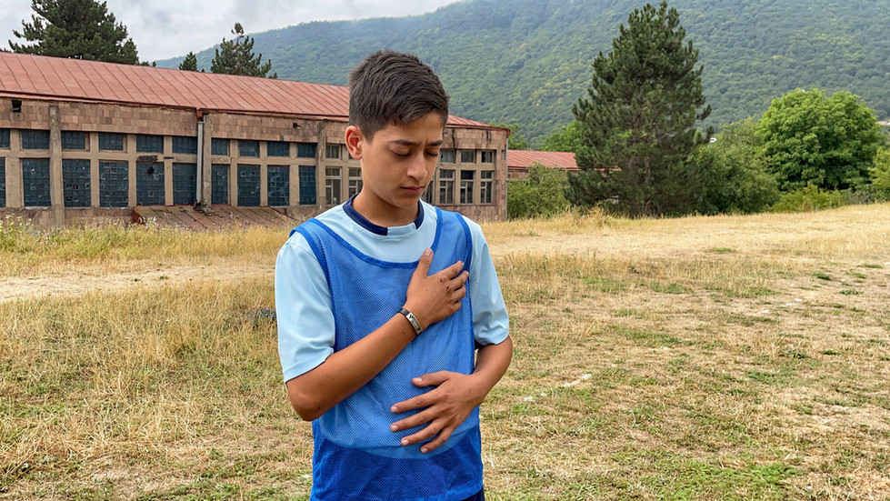 A young soccer player practicing mindfulness