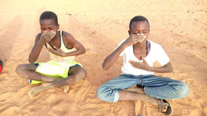 Two boys practicing mindfulness in Chad