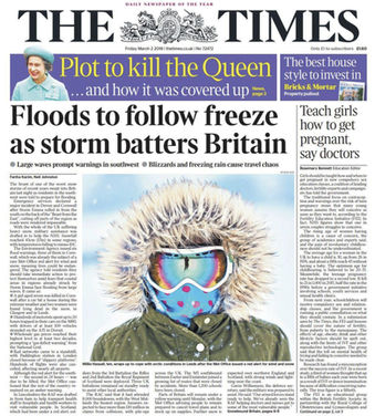 Child in the snow wearing hood, ski mask and snood