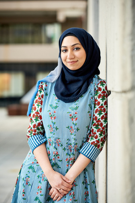 University student leaning against wall