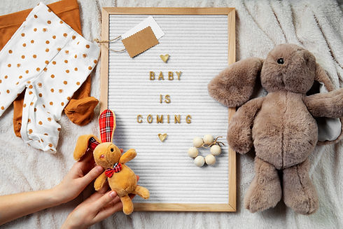 top-view-hands-holding-baby-toy.jpg