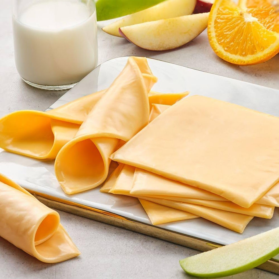 Slices of processed cheese on plate