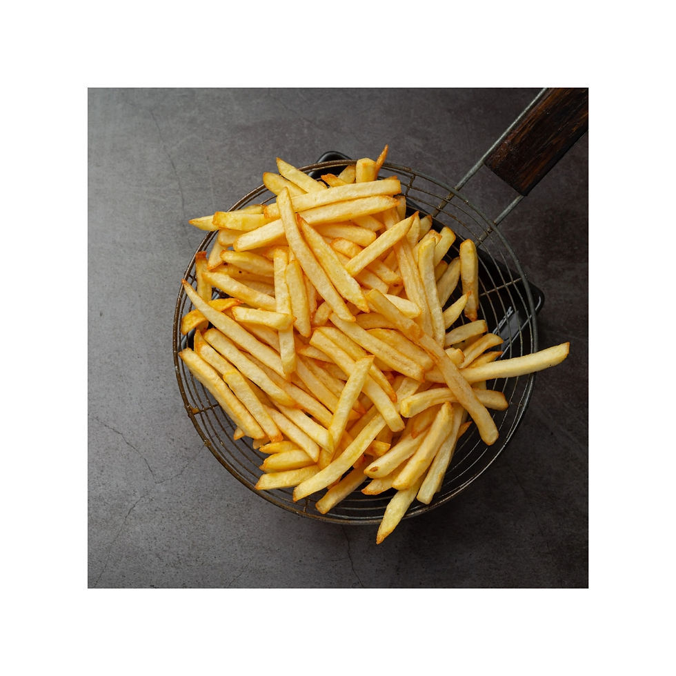 Golden french fries in a wire basket