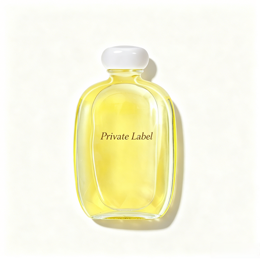 Private Label Mango Body Massage Oil in clear glass bottle with white cap, showcasing fast-penetrating lightweight oil textur
