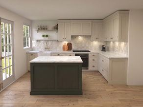 Bright shaker kitchen with cream cabinets, dark green island, marble counters, wood floors, and sunlit French doors.