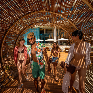 Young friends walking through trendy tunnel