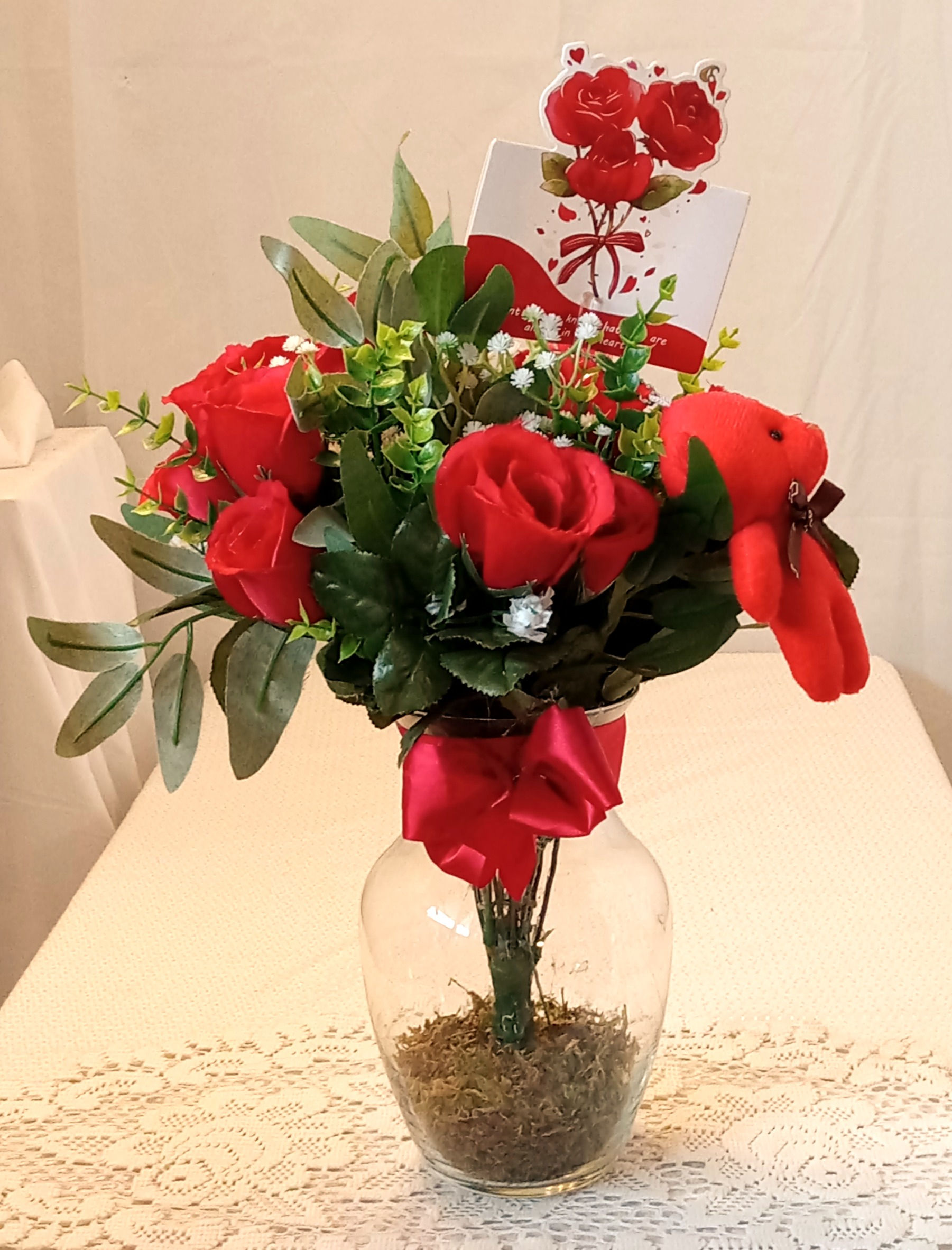 A Dozen Large Red Roses With Greenery And Baby's Breath