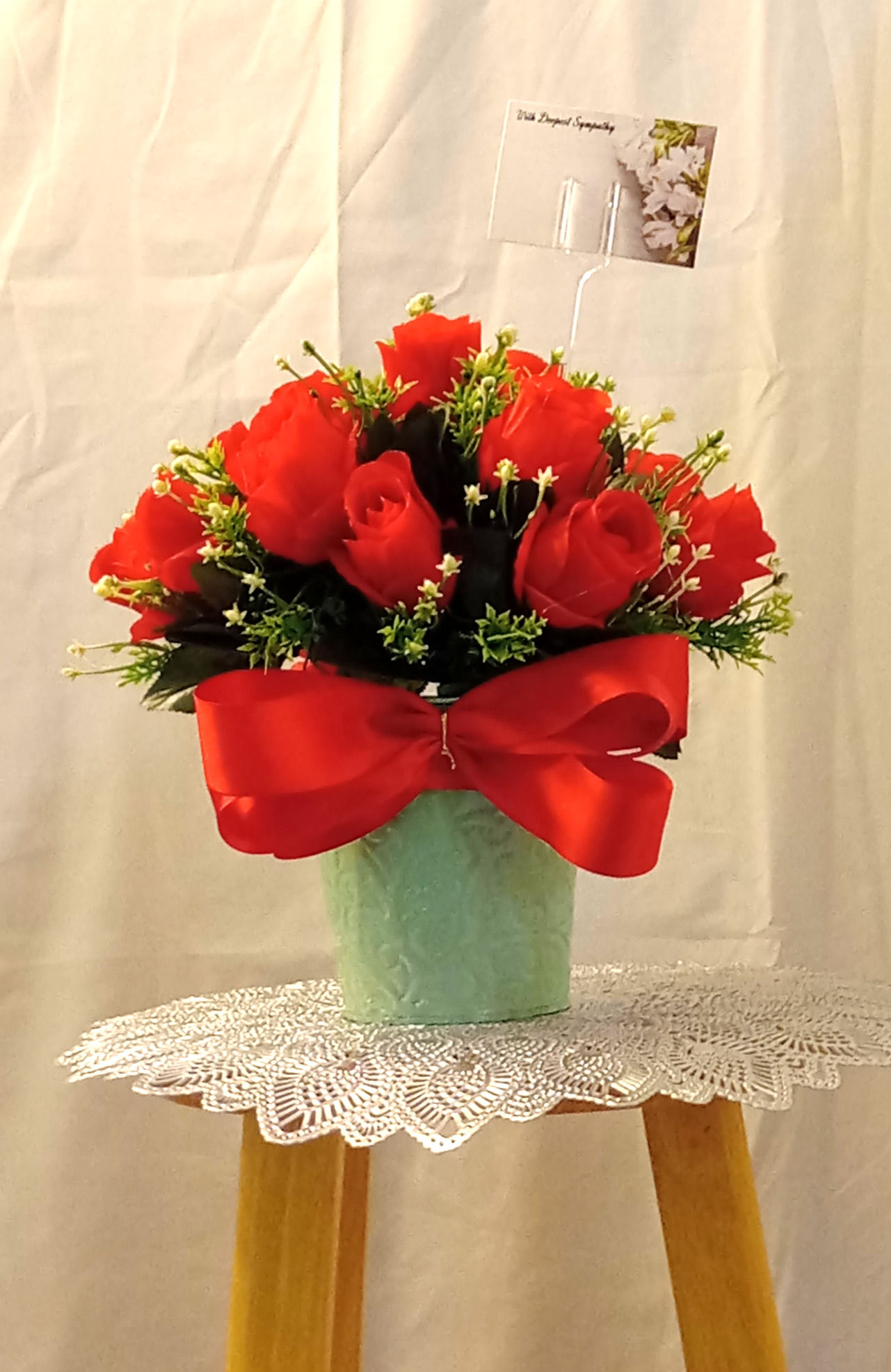 18 Red Roses And A Red Ribbon In A Small Green Pot