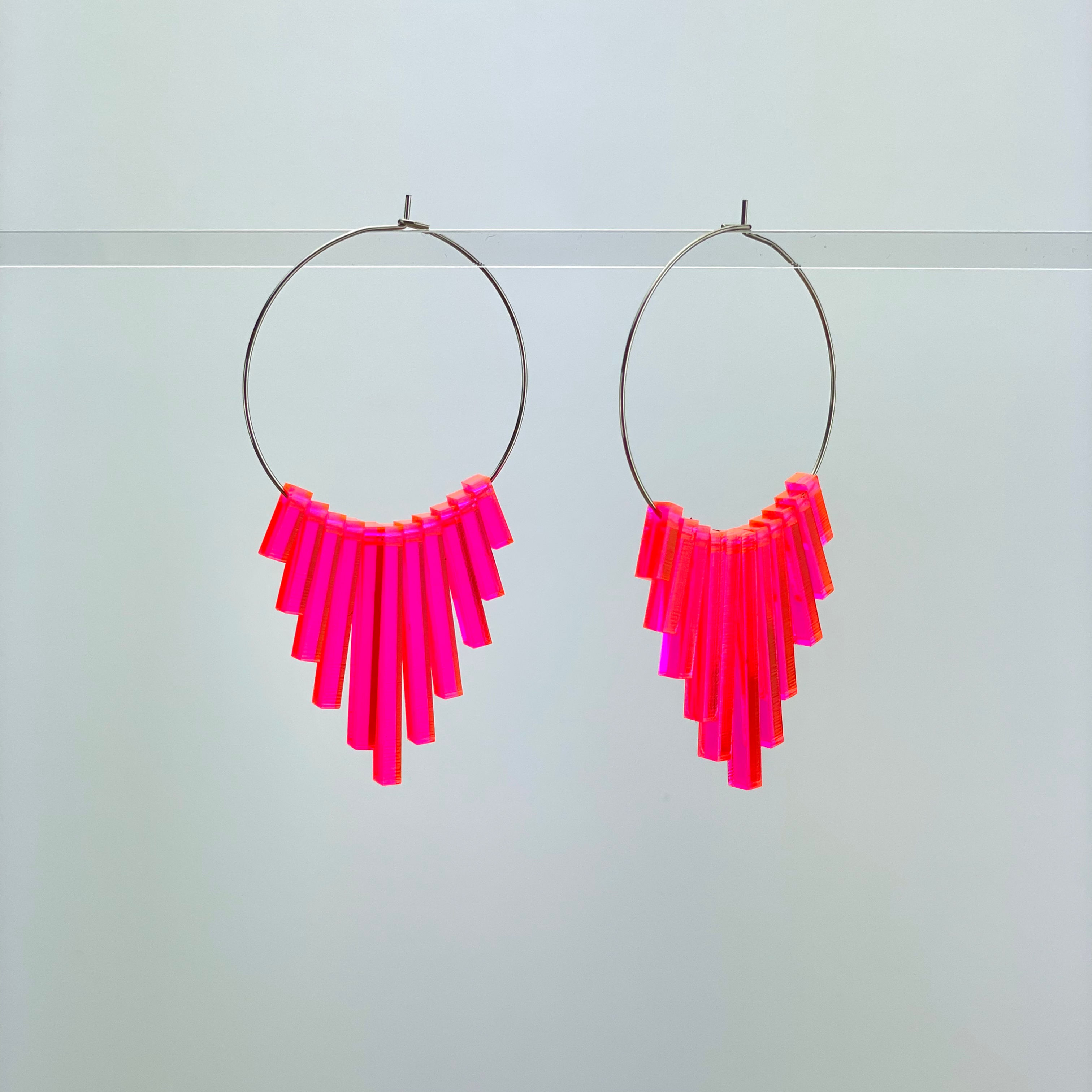 Earrings circles with sticks neon pink