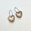 Thumbnail: Heart earrings on a beige ring