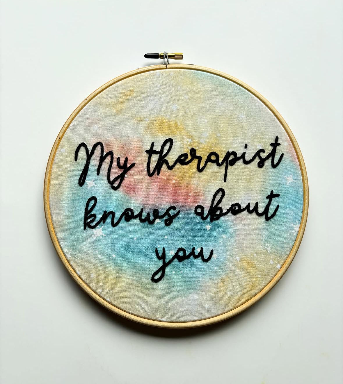 Embroidery hoop art with text saying: My therapist knows about you.